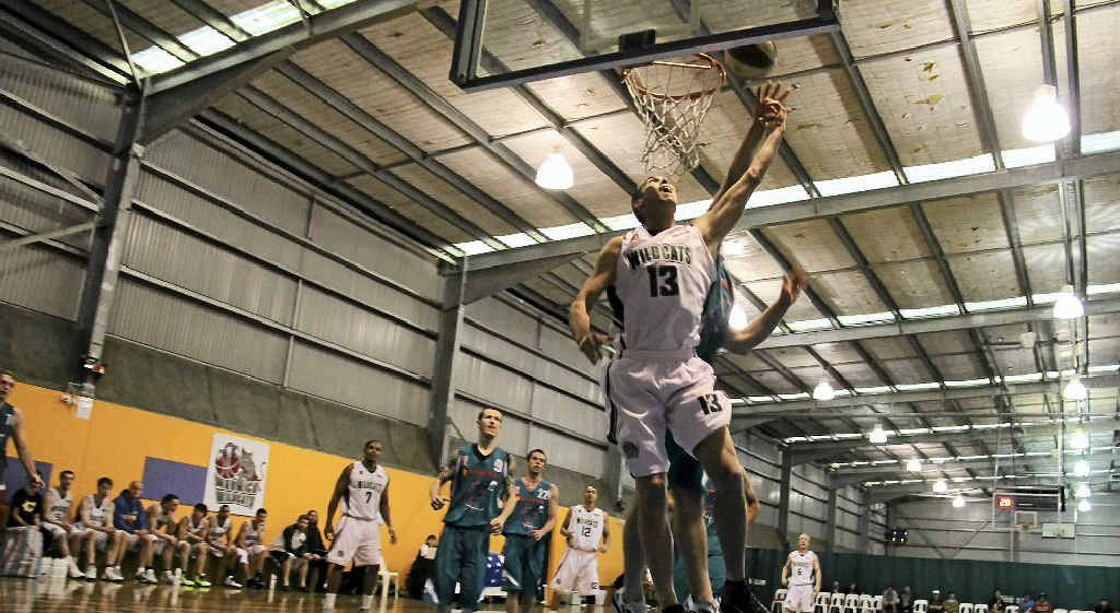 Wildcats forward Cameron Scutts takes a leap to get the ball through the hoop in the game against table leaders Gold Coast Seahawks on Sunday Wildcats forward Cameron Scutts takes a leap to get the ball through the hoop in the game against table leaders Gold Coast Seahawks on Sunday